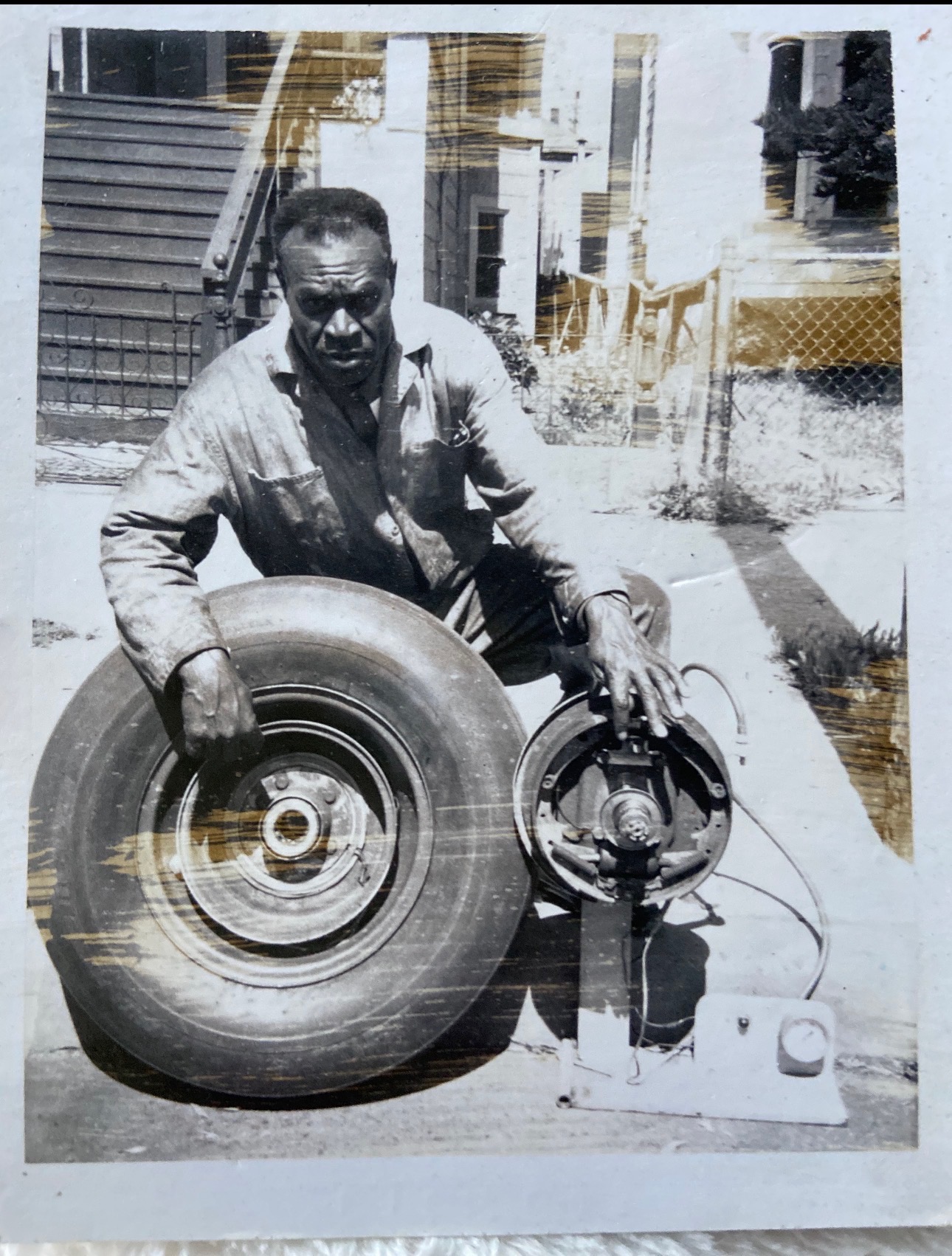 Family-supplied photograph of Andrew Robinson beside a tire and mechanical assembly